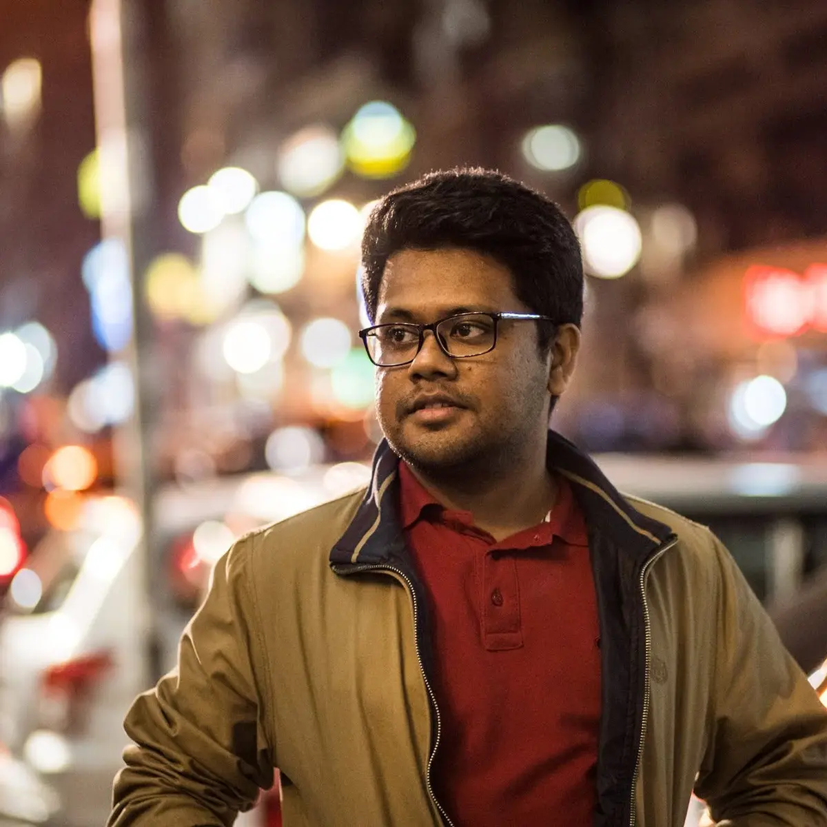 J S Mahboob on a city street after dark